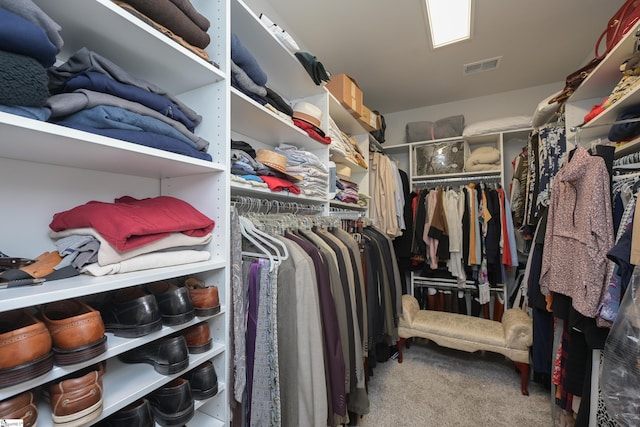 spacious closet with visible vents and carpet flooring