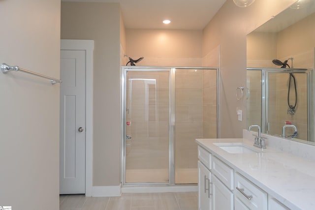 full bath featuring tile patterned flooring, recessed lighting, vanity, and a stall shower