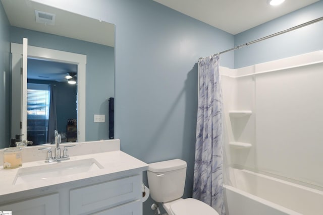 bathroom featuring vanity, shower / tub combo, toilet, and visible vents