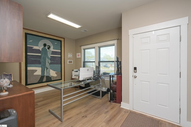 foyer with visible vents and light wood-type flooring