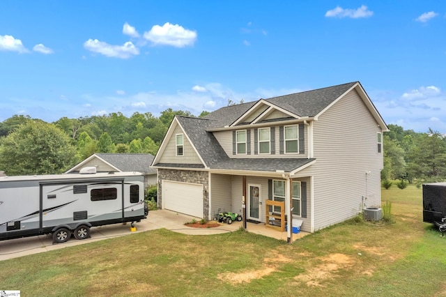 view of front of property featuring a front lawn, cooling unit, concrete driveway, and a shingled roof