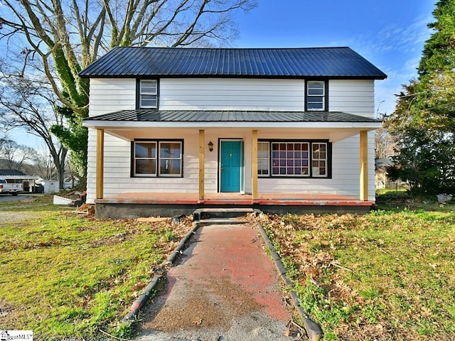 view of front facade with metal roof and covered porch