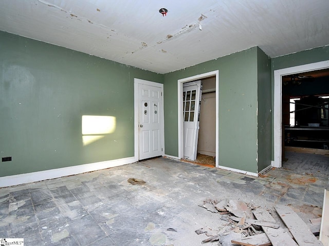 empty room with baseboards