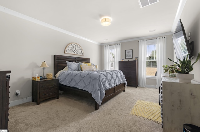 bedroom with crown molding, baseboards, visible vents, and light carpet