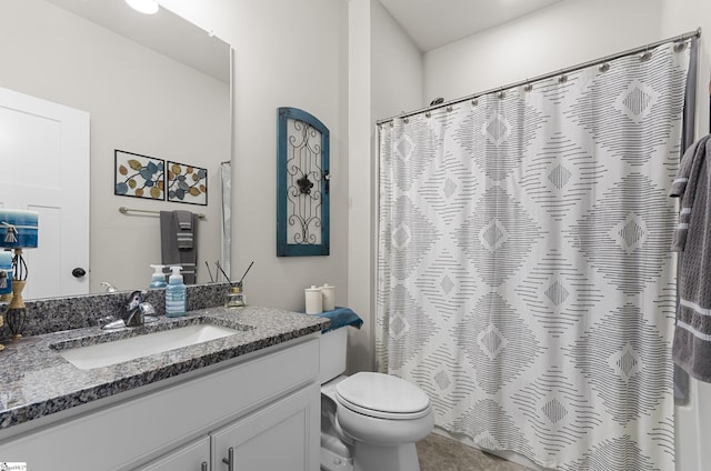 bathroom featuring curtained shower, toilet, and vanity