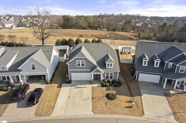 birds eye view of property with a residential view