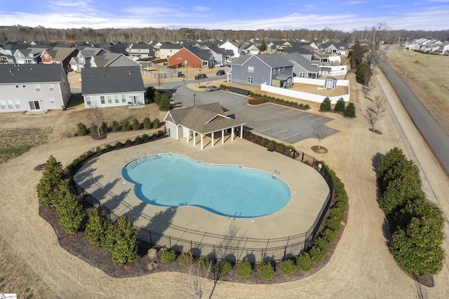 pool featuring a residential view and fence