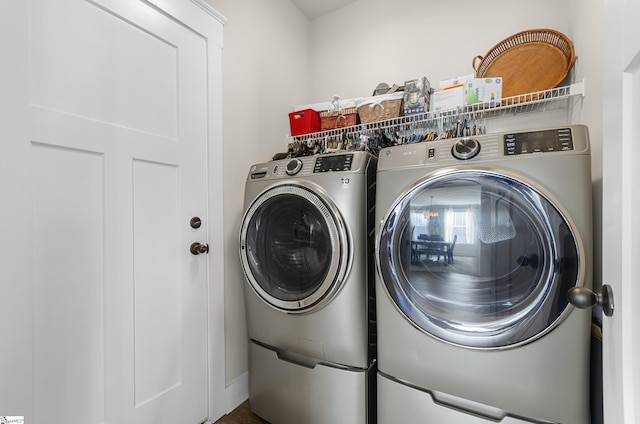 laundry area featuring laundry area and washing machine and dryer