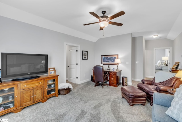 carpeted home office featuring lofted ceiling, a ceiling fan, and baseboards