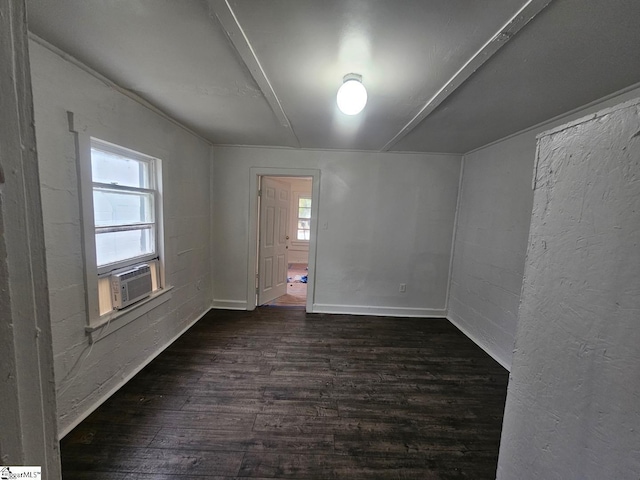 empty room with dark wood finished floors and cooling unit