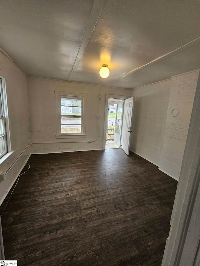 empty room with dark wood-style flooring