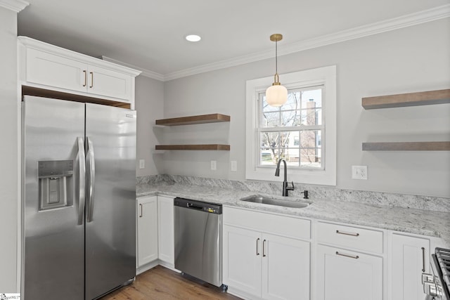 kitchen with open shelves, a sink, appliances with stainless steel finishes, white cabinets, and crown molding