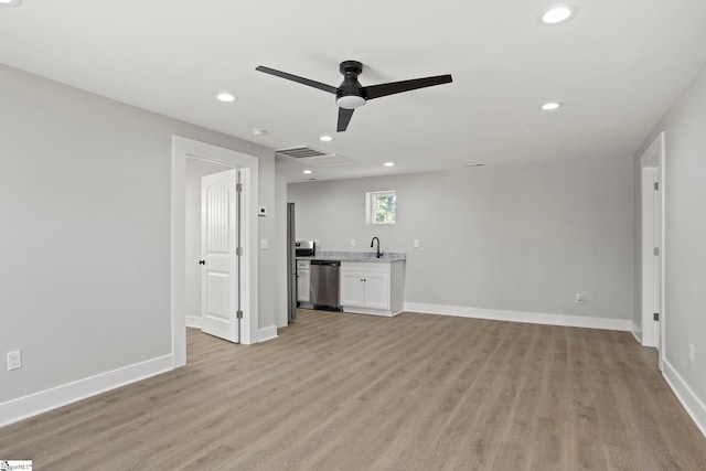 unfurnished living room featuring visible vents, light wood-style flooring, a ceiling fan, recessed lighting, and baseboards