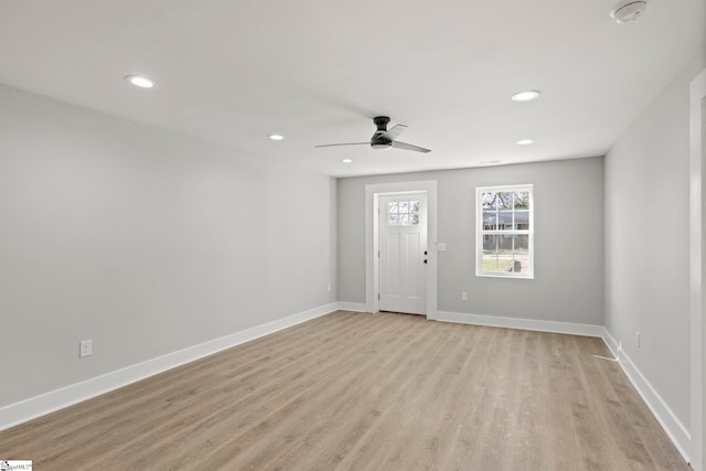 interior space featuring a ceiling fan, recessed lighting, baseboards, and light wood finished floors