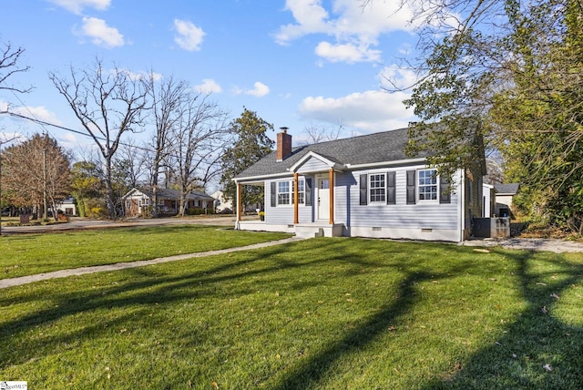 view of front of house featuring a shingled roof, a front yard, a chimney, and crawl space