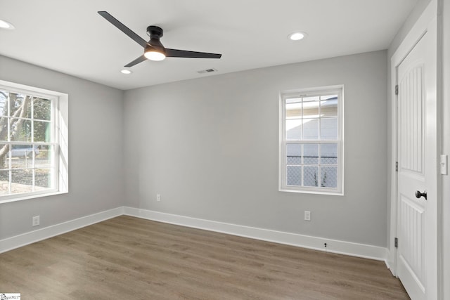 unfurnished bedroom featuring visible vents, recessed lighting, wood finished floors, and baseboards