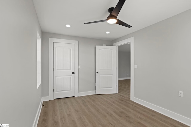 unfurnished bedroom featuring recessed lighting, baseboards, light wood-style flooring, and ceiling fan