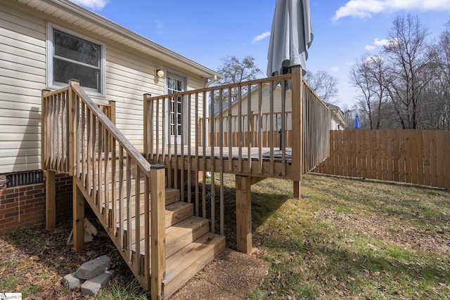 wooden deck featuring stairway and fence