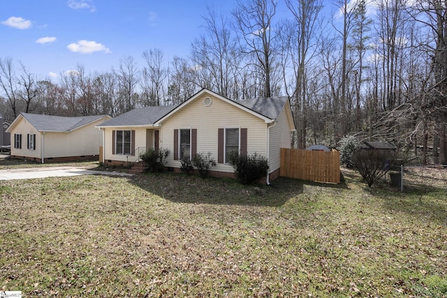 ranch-style house featuring crawl space, a front yard, and fence