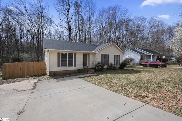 ranch-style home featuring fence, roof with shingles, and crawl space