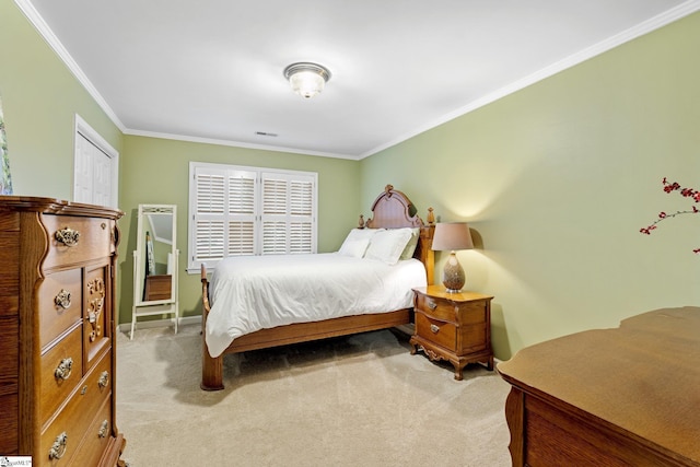 carpeted bedroom with crown molding, baseboards, and visible vents