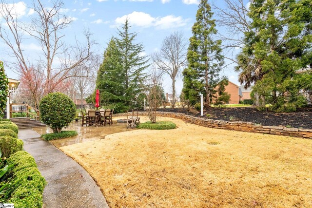 surrounding community with a patio area