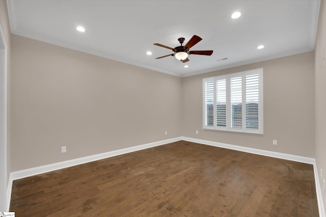 spare room with dark wood-type flooring, baseboards, ornamental molding, recessed lighting, and a ceiling fan