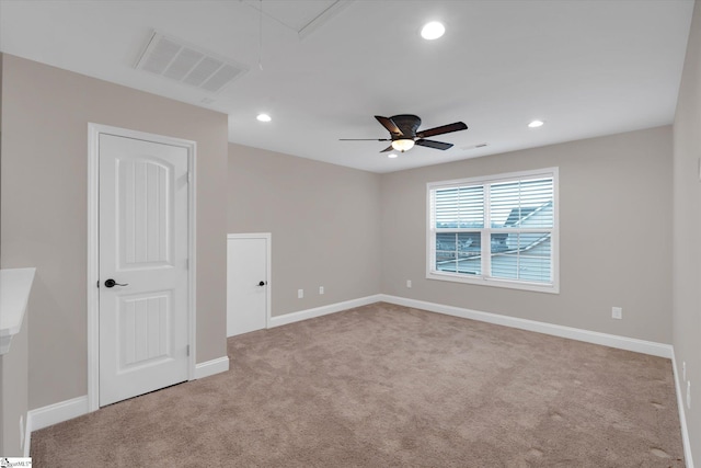 unfurnished room featuring attic access, recessed lighting, visible vents, and carpet floors