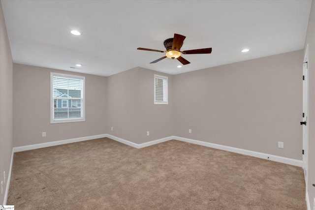 empty room featuring carpet flooring, recessed lighting, baseboards, and ceiling fan