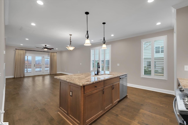 kitchen with baseboards, dark wood finished floors, dishwasher, pendant lighting, and a sink