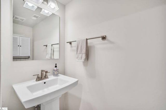 bathroom with a sink and visible vents