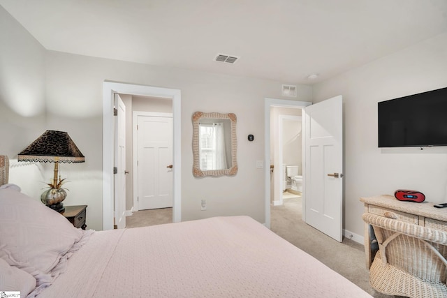 bedroom featuring visible vents, light colored carpet, and baseboards