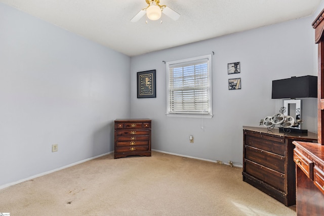 bedroom with baseboards, light carpet, and a ceiling fan