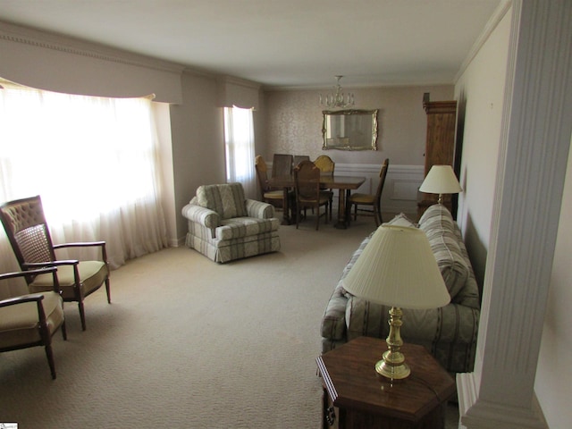 carpeted living room featuring ornamental molding