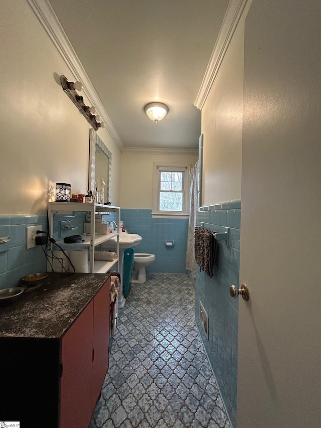 bathroom with visible vents, ornamental molding, wainscoting, tile walls, and toilet