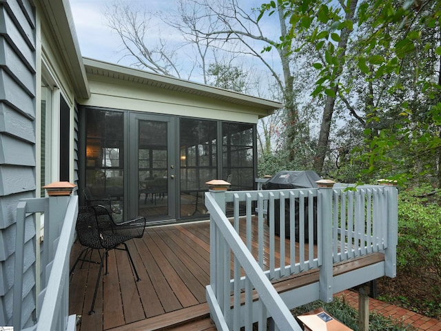 deck with a sunroom