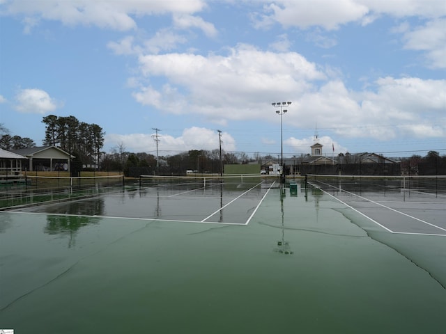 view of tennis court with fence