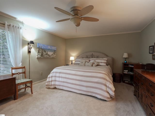 bedroom featuring light colored carpet, crown molding, baseboards, and ceiling fan