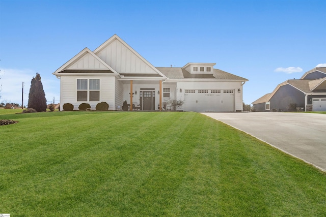 view of front of property featuring an attached garage, board and batten siding, concrete driveway, and a front yard