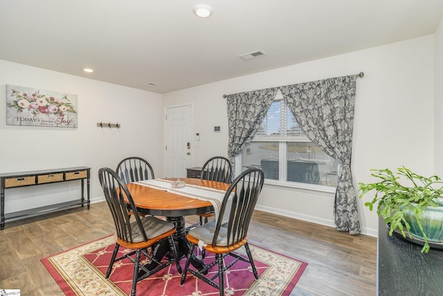 dining room featuring recessed lighting, visible vents, baseboards, and wood finished floors