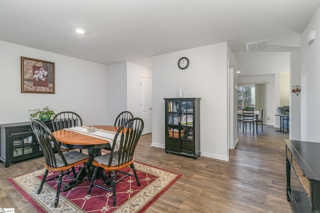 dining space featuring recessed lighting, visible vents, baseboards, and wood finished floors