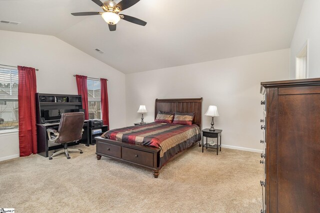 bedroom with lofted ceiling, light colored carpet, visible vents, and baseboards