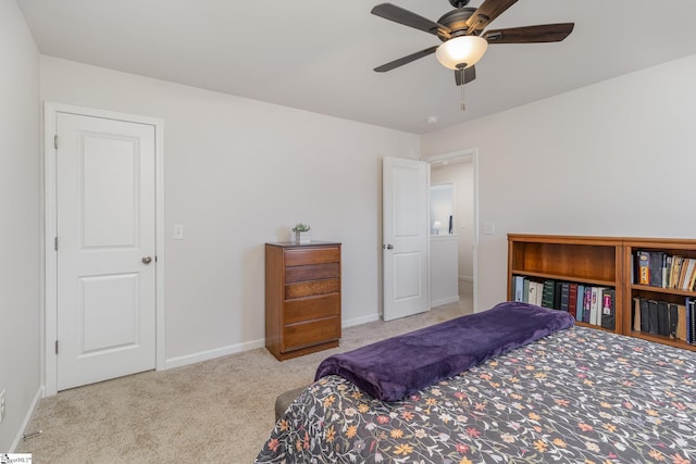 carpeted bedroom with baseboards and ceiling fan