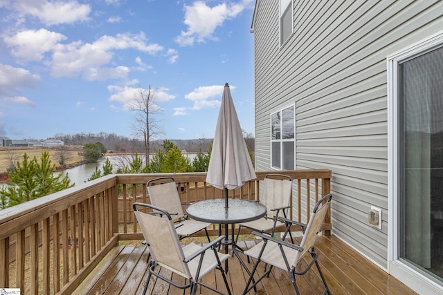 wooden deck featuring a water view