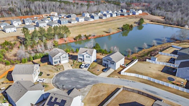 bird's eye view with a residential view and a water view