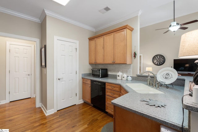 kitchen with visible vents, dishwasher, ornamental molding, light wood-style floors, and a sink