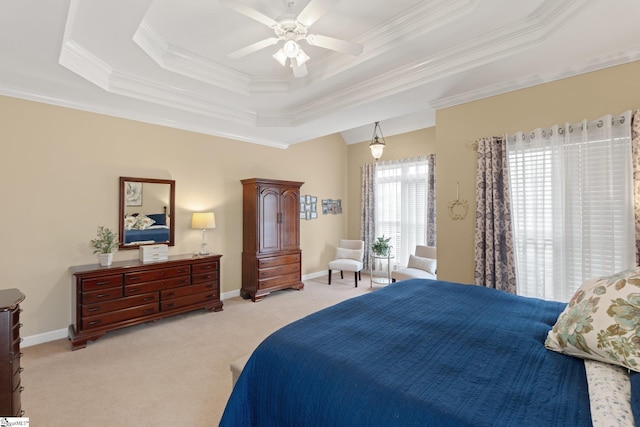 bedroom featuring a tray ceiling, baseboards, light colored carpet, and ornamental molding