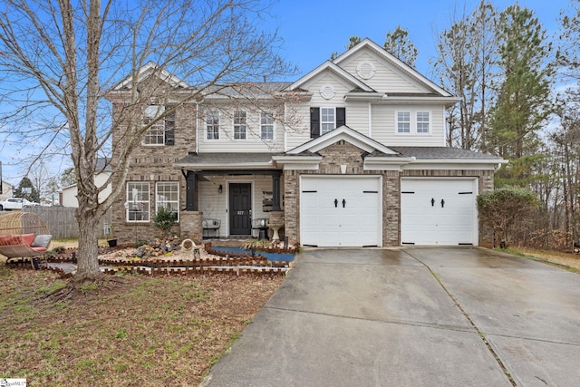 view of front of home featuring fence, covered porch, concrete driveway, a garage, and brick siding