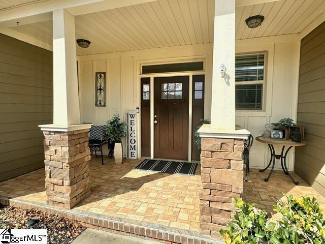 doorway to property featuring a porch