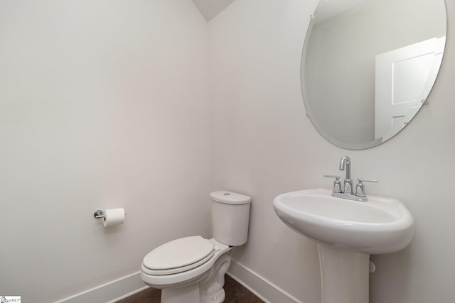 100 Outback Dr, Greer, SC 29650 - half bath with a sink, toilet, baseboards, and wood finished floors
